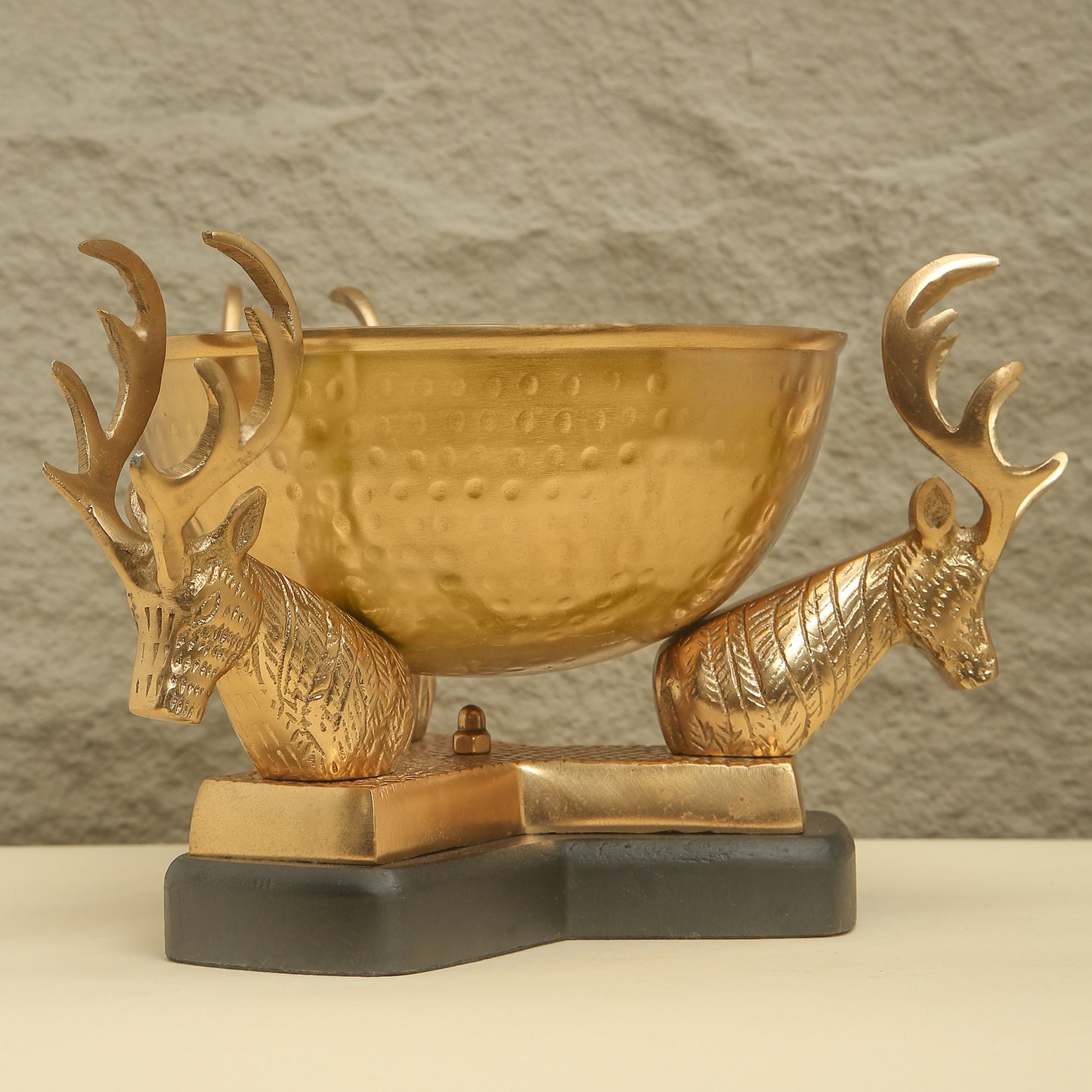 Gold trophy with deer heads on a gray background