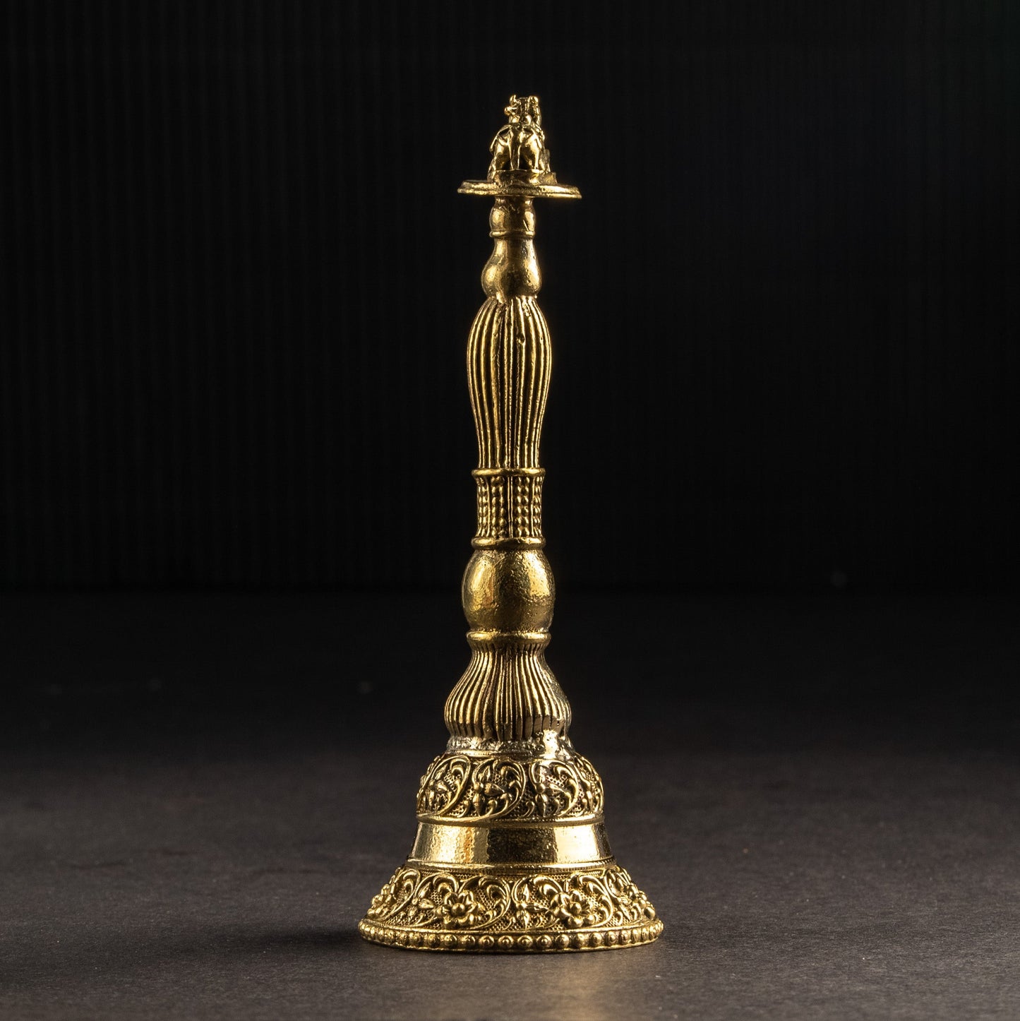 Decorative gold object on a black background