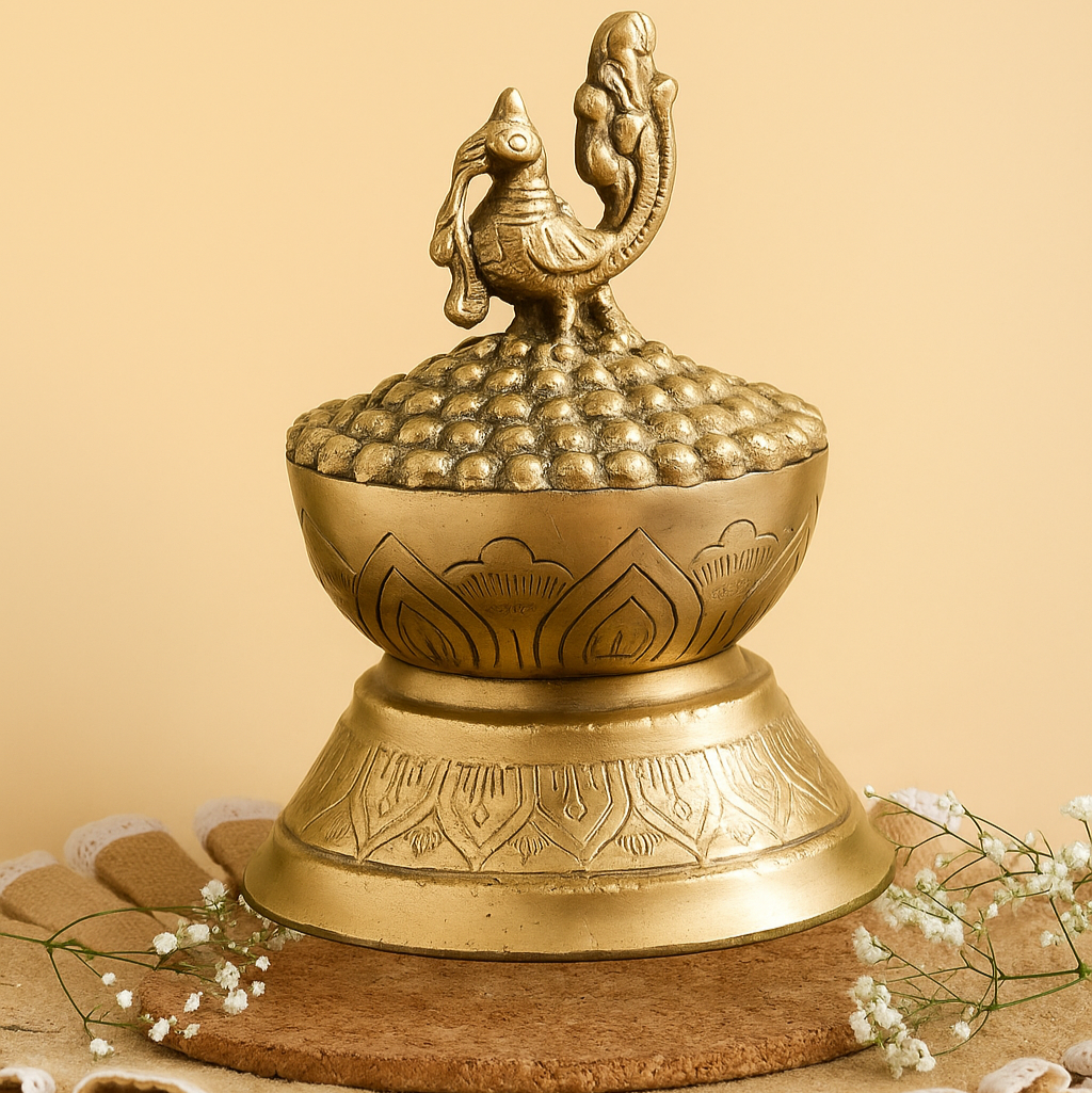 Decorative brass object with intricate designs on a beige background