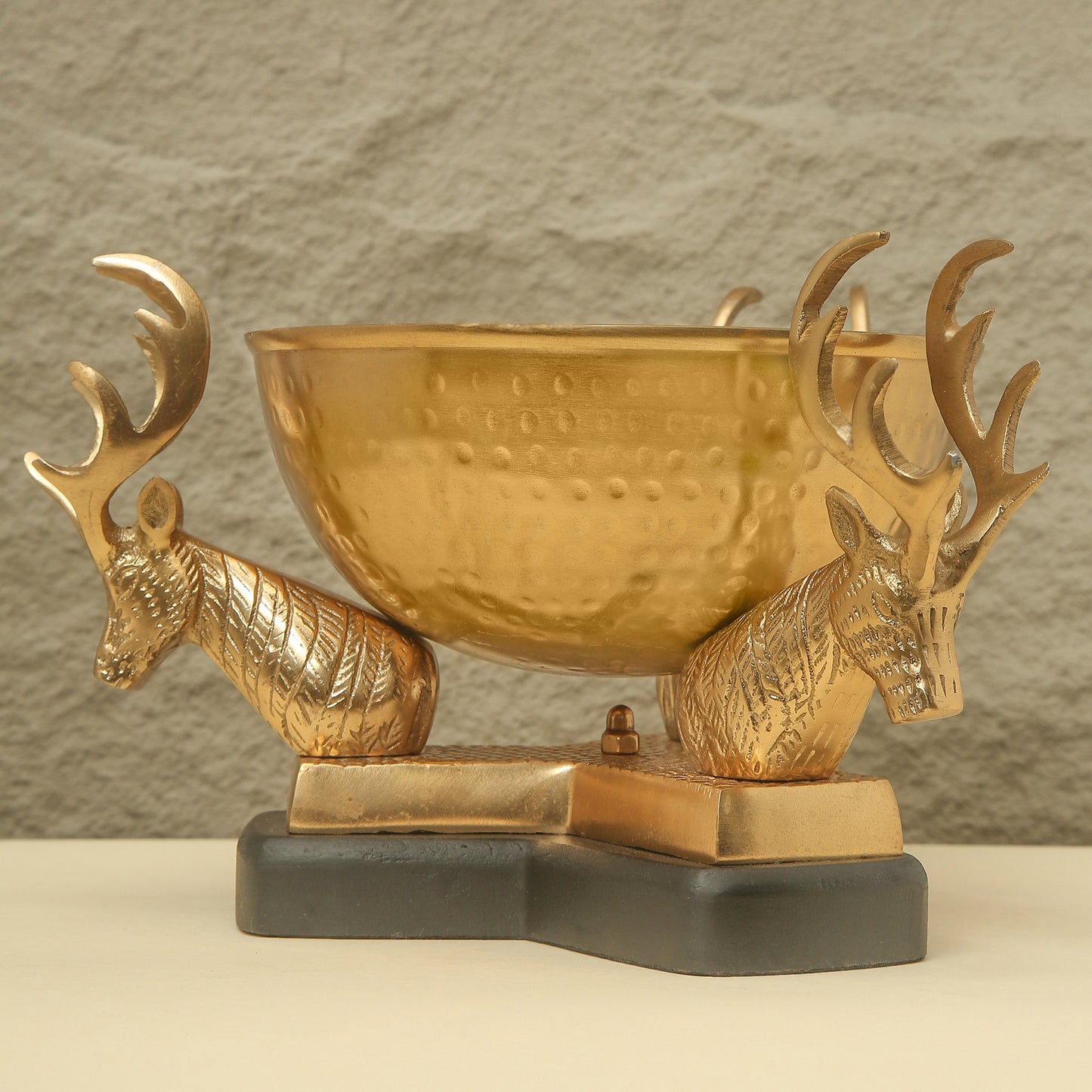 Gold trophy with deer heads on a gray background