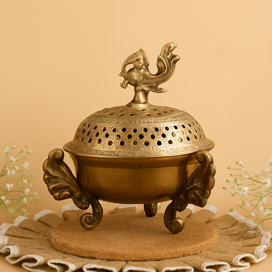 Bronze incense burner with lid featuring a rooster on a beige background