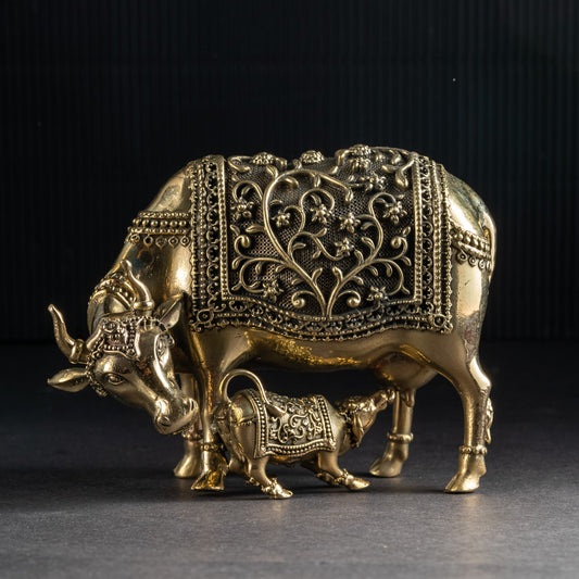 Decorative brass bull figurine on a dark background