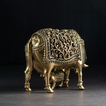 Decorative brass elephant on a dark background