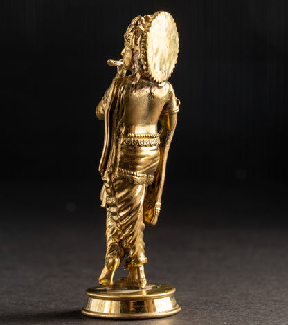 Gold-colored statue on a dark background