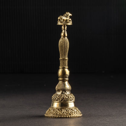 Gold-colored decorative object on a black background