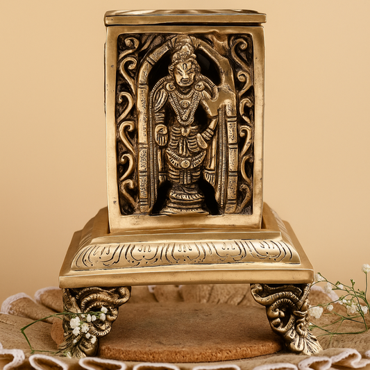 Decorative brass sculpture on a beige background