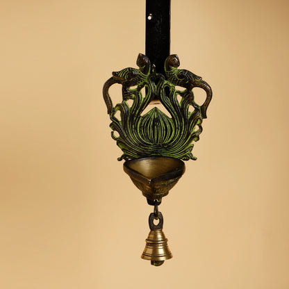 Decorative hanging lamp with intricate design on a beige background