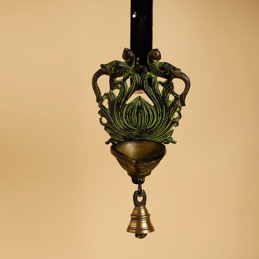 Decorative hanging lamp with intricate design on a beige background