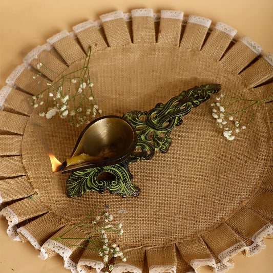Decorative plate with a decorative spoon and small plants on a beige background