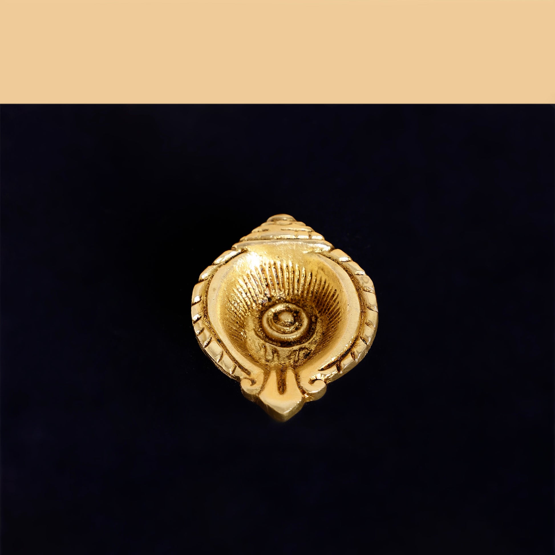 Gold decorative element on a black background