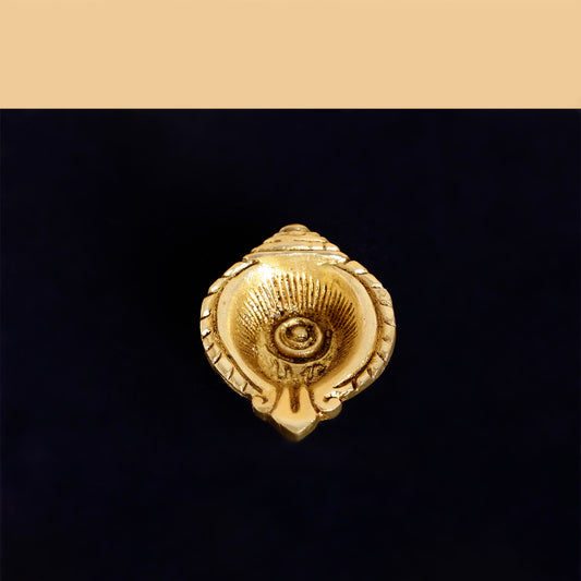 Gold decorative element on a black background
