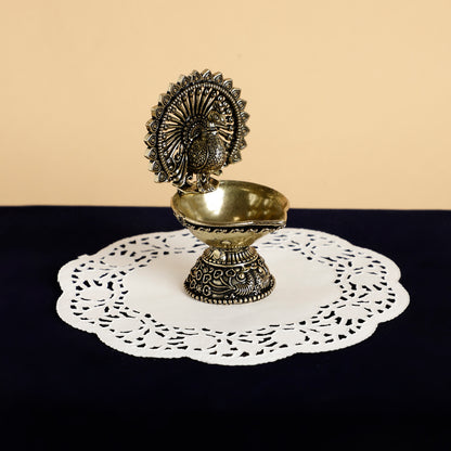 Antique Brass Peacock Diya – Handcrafted Traditional Oil Lamp for Pooja & Festive Decor