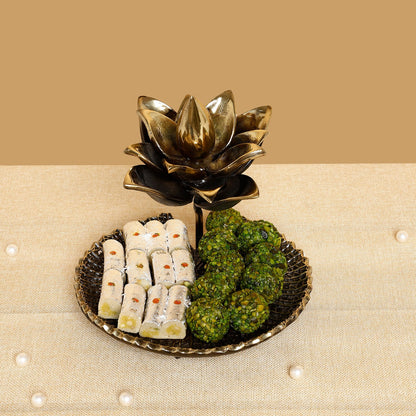 Decorative plate with sweet and green items on a beige surface
