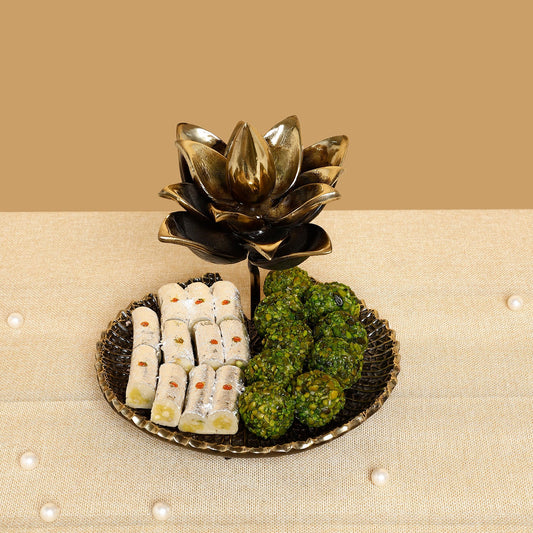Decorative plate with sweet and green items on a beige surface