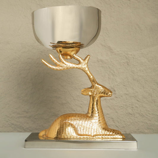 Decorative lamp with gold deer design on a neutral background