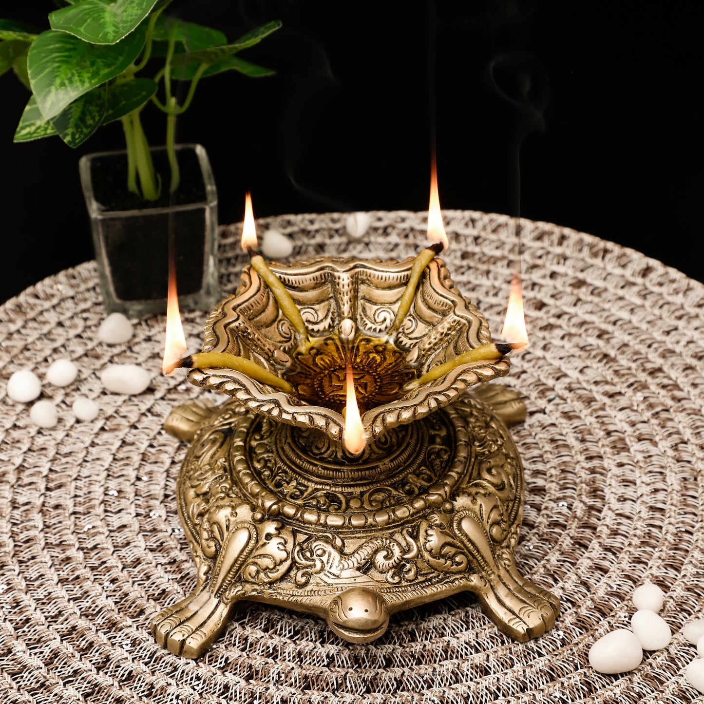 Decorative metal lamp with candles on a textured surface