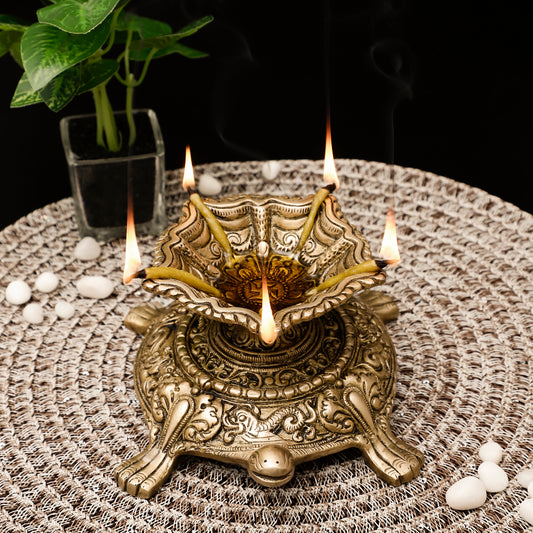 Decorative metal lamp with candles on a textured surface